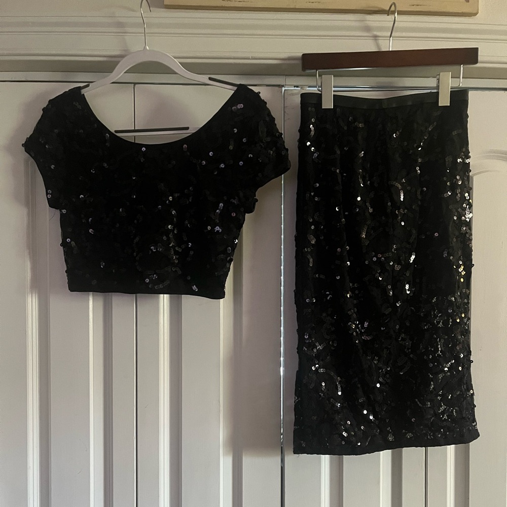 Black cocktail dress. It’s a 2 piece.